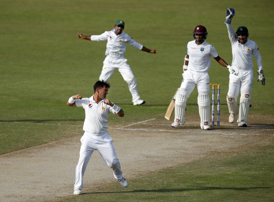 Yasir Shah celebrates after trapping Leon Johnson in front