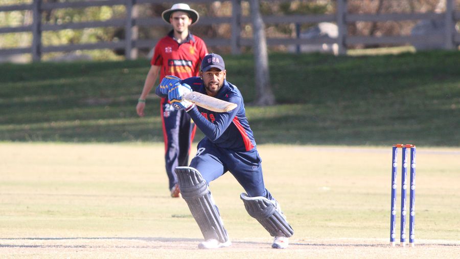 Alex Amsterdam drives through cover on his way to a century