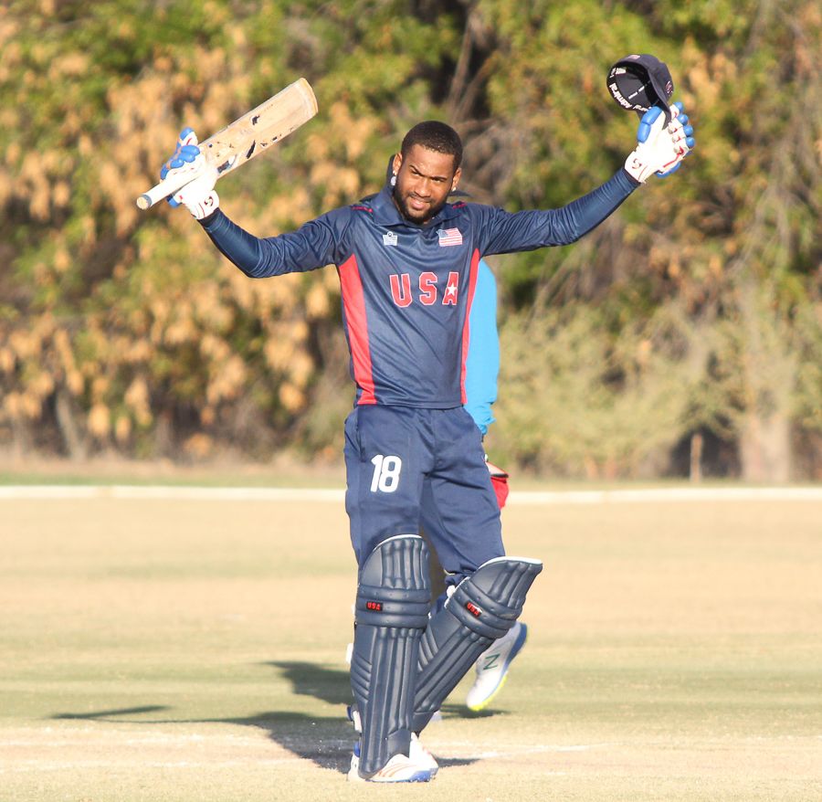 Alex Amsterdam salutes the USA bench after reaching 100