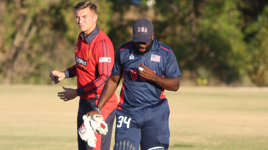 Nicholas Standford walks off to get medical attention after being hit in the mouth