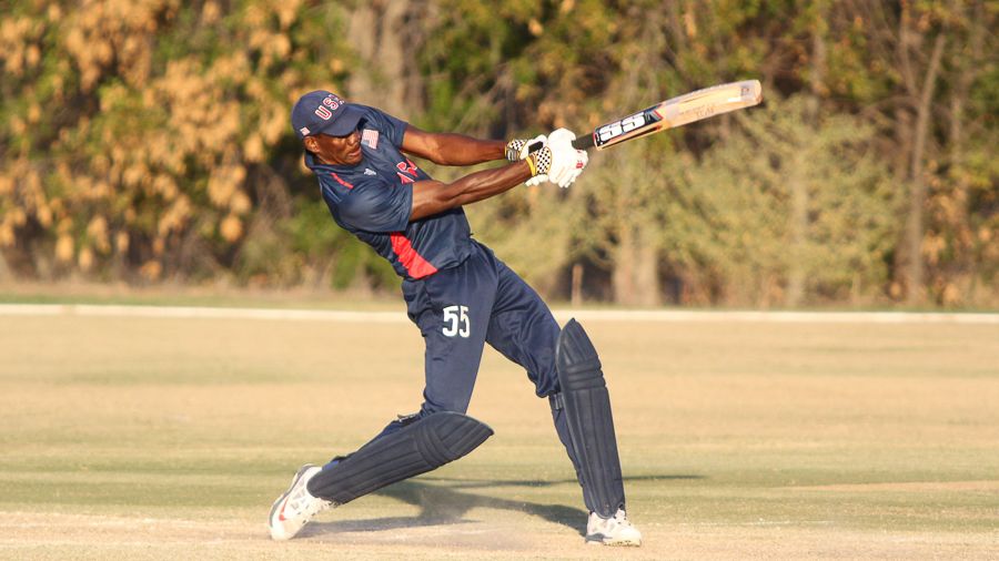 Elmore Hutchinson drives Rhys Palmer for six over long-off