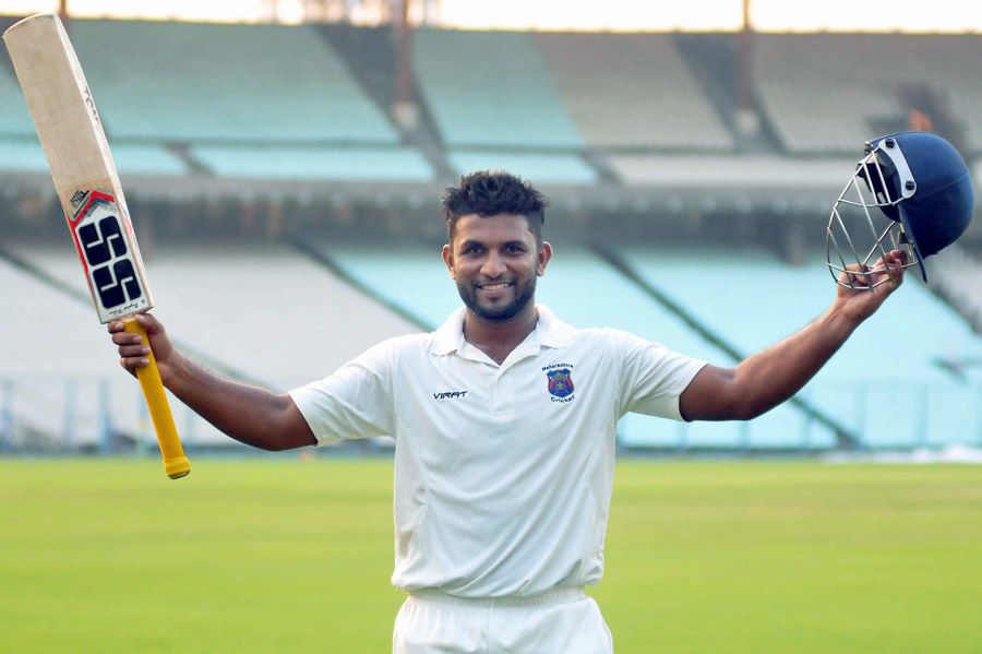 Naushad Shaikh celebrates after his century