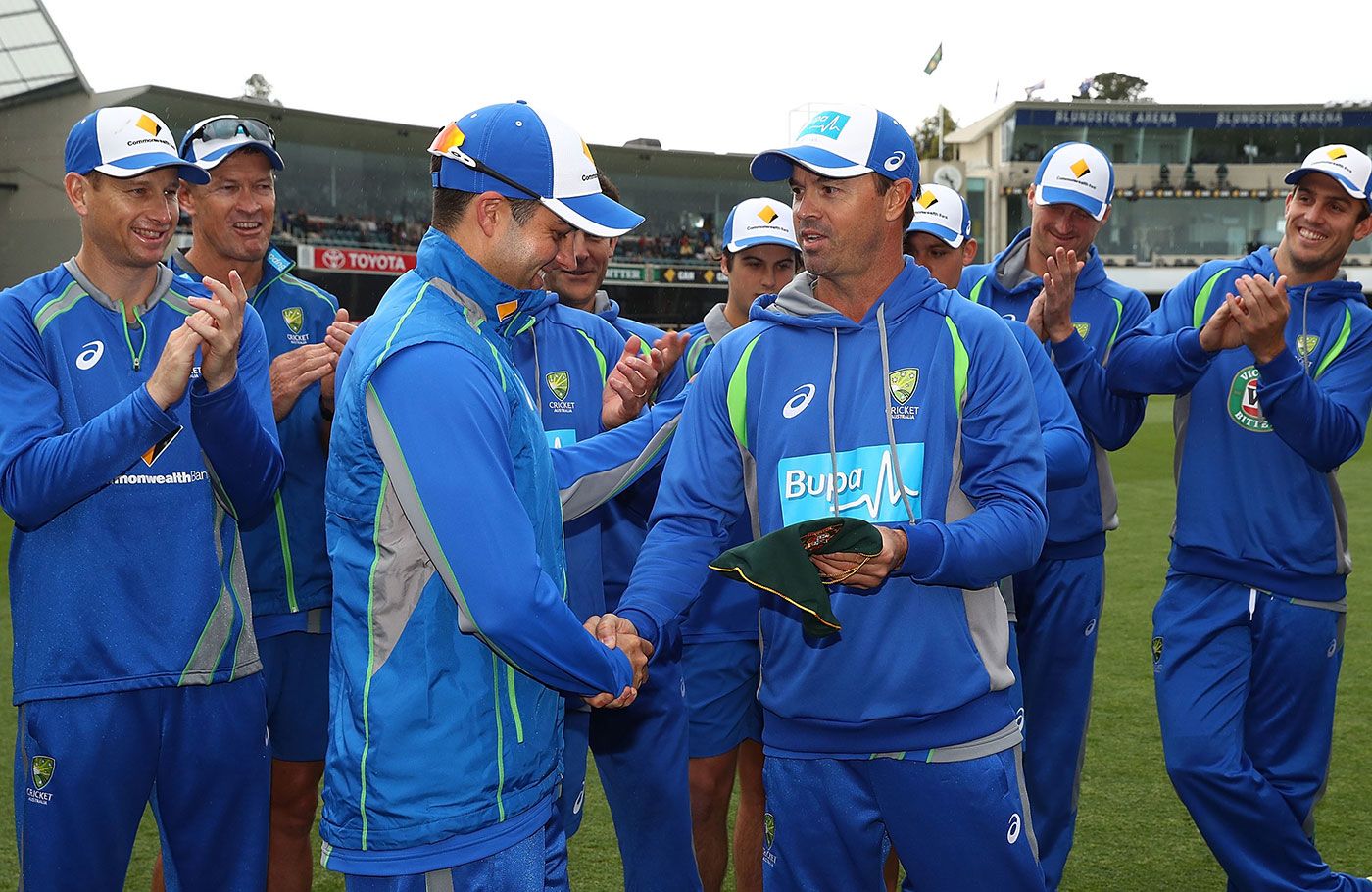 Callum Ferguson receives his cap from fielding coach Greg Blewett