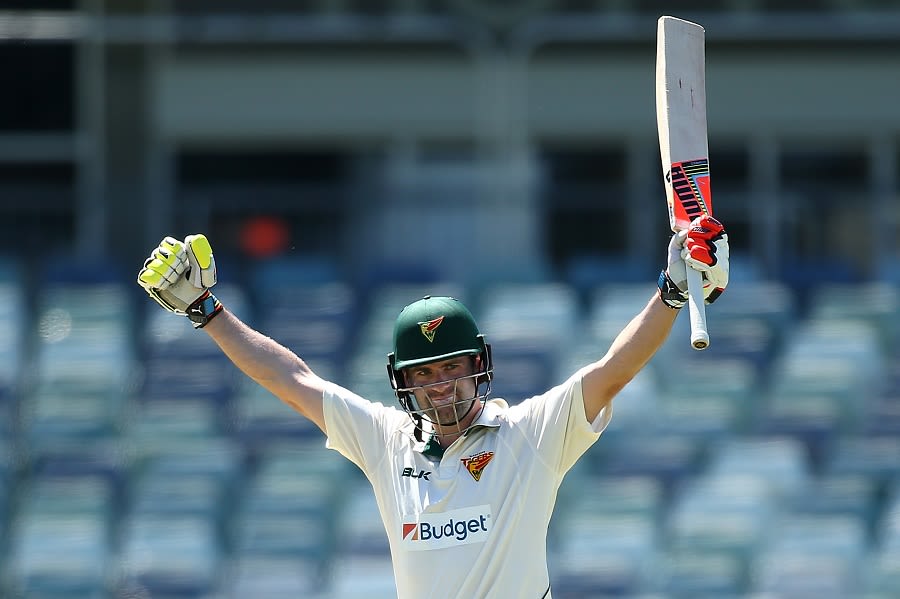 Alex Doolan celebrates his century