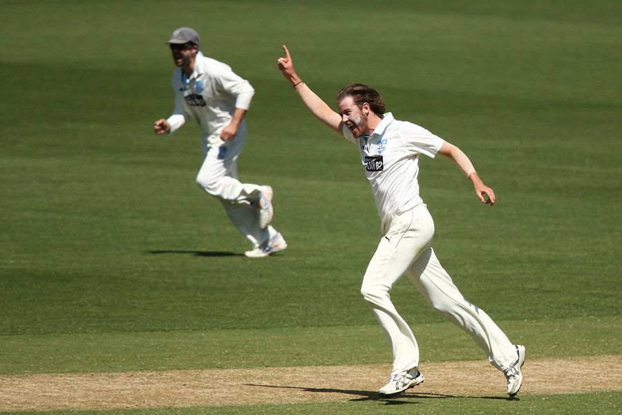 Charles Stobo celebrates the wicket of Kelvin Smith