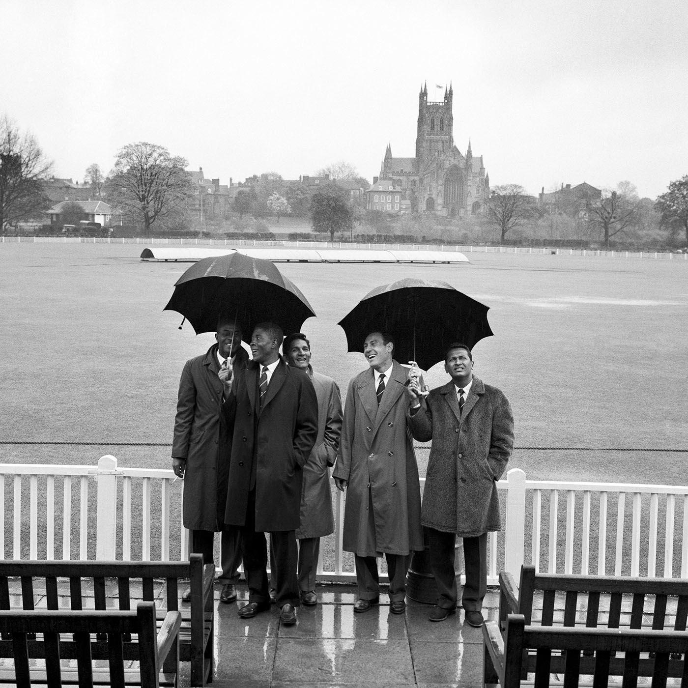 West Indies players shelter from the rain