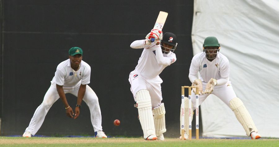 Isaiah Rajah drives down the ground