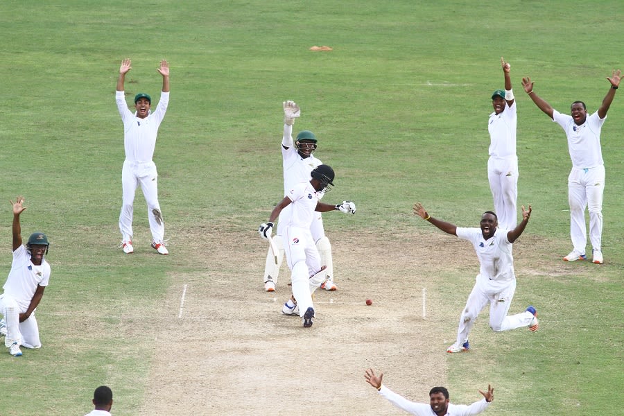 Guyana players go up in unison against Isaiah Rajah