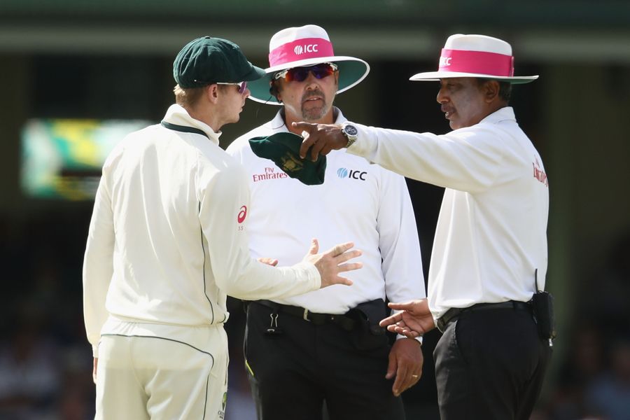 Steven Smith talks to the umpires