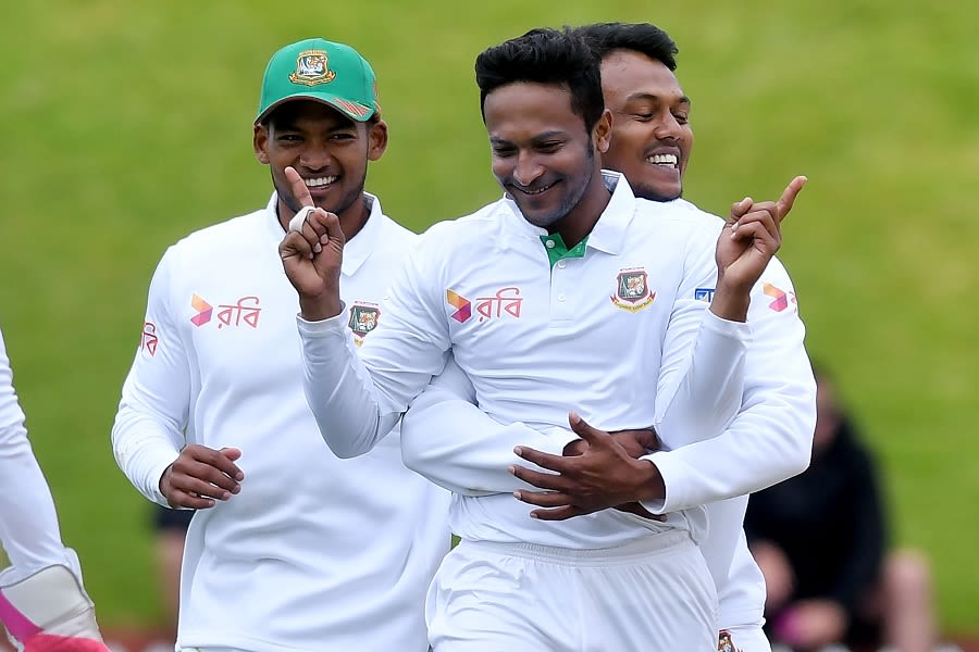 Shakib Al Hasan gets a hug from Subashis Roy after picking up a wicket