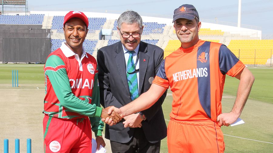 Oman's Sultan Ahmed and Netherlands' Peter Borren shake hands at the toss