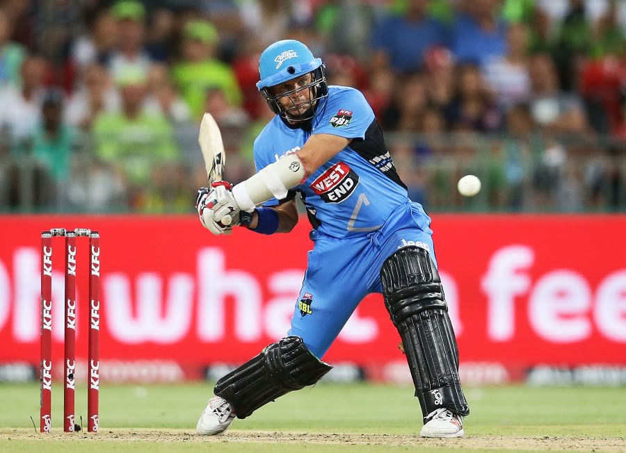 Brad Hodge looks to heave the ball away