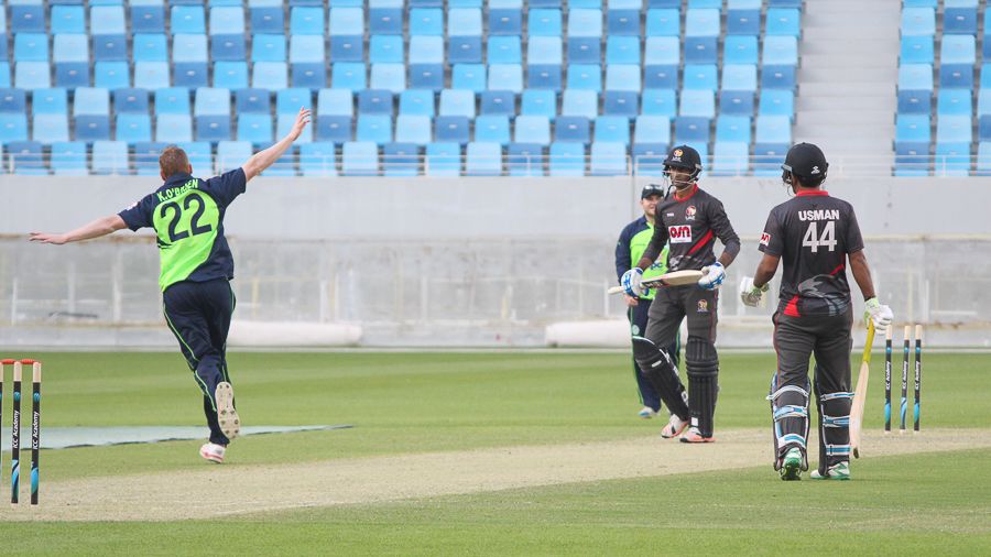Kevin O'Brien flies away after bowling Mohammad Shahzad