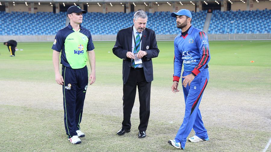 Nawroz Mangal spins the coin toss in his final match for Afghanistan