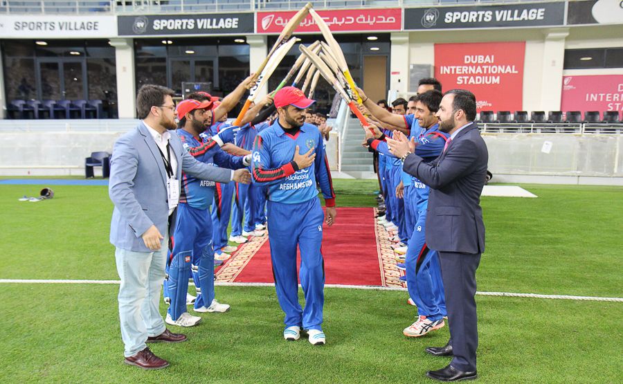 Nawroz Mangal gets a guard of honour from his team