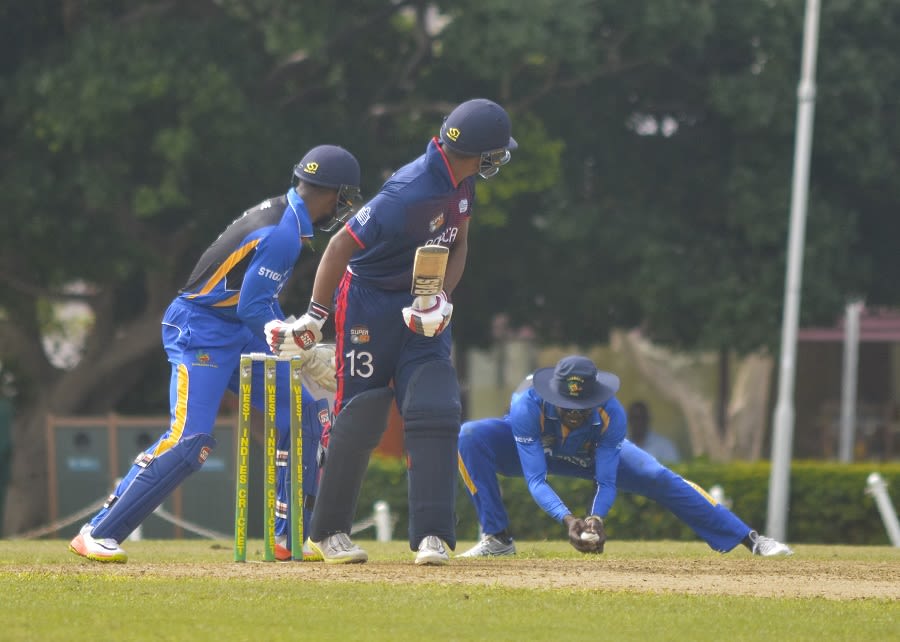 Sulieman Benn pulls off a low catch at leg gully
