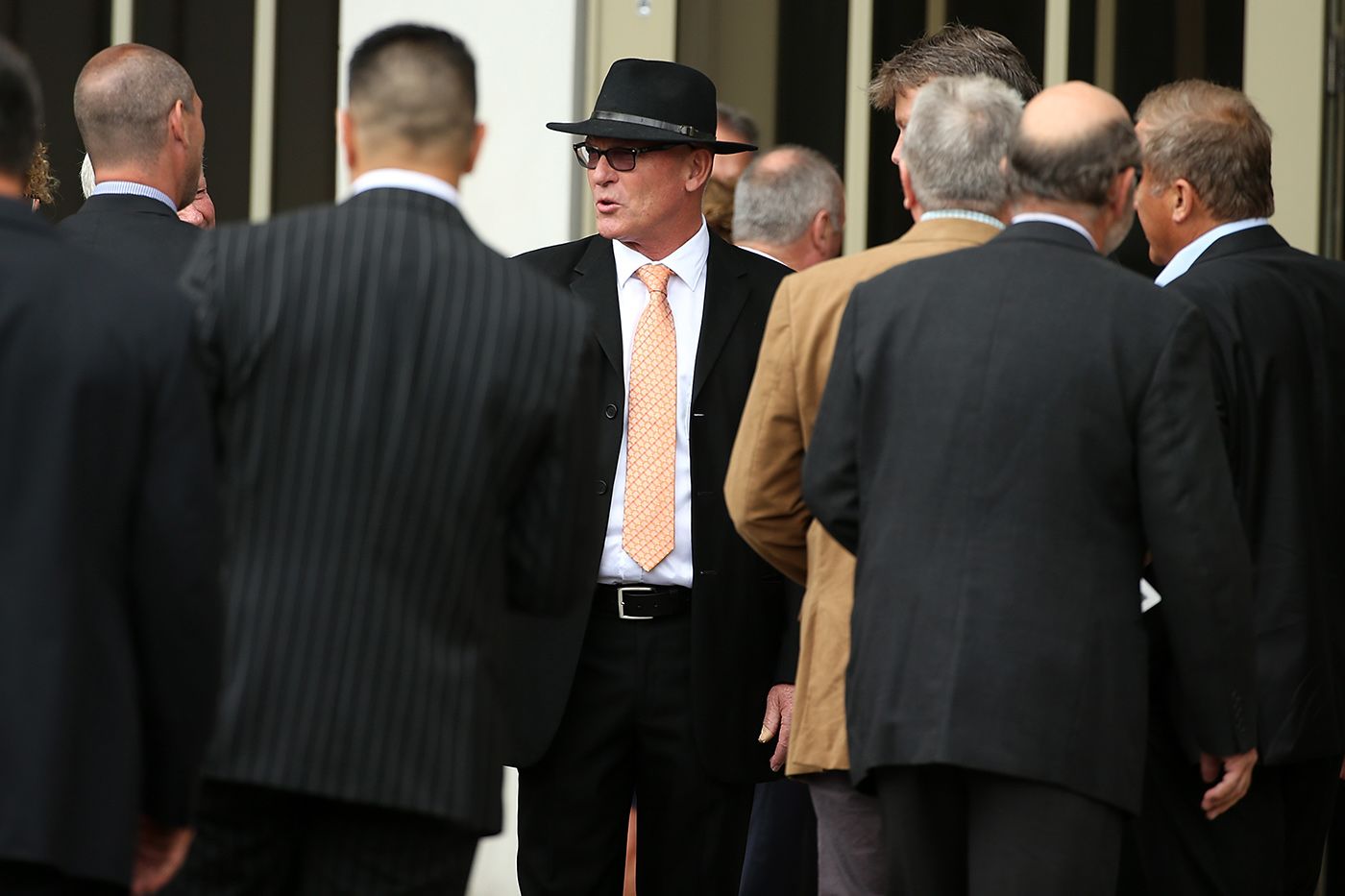 Jeff Crowe greets mourners at the funeral for his brother Martin Crowe