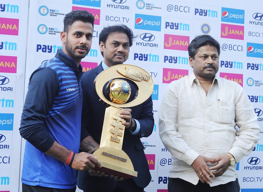 East Zone captain Manoj Tiwary receives the trophy from chairman of selectors MSK Prasad