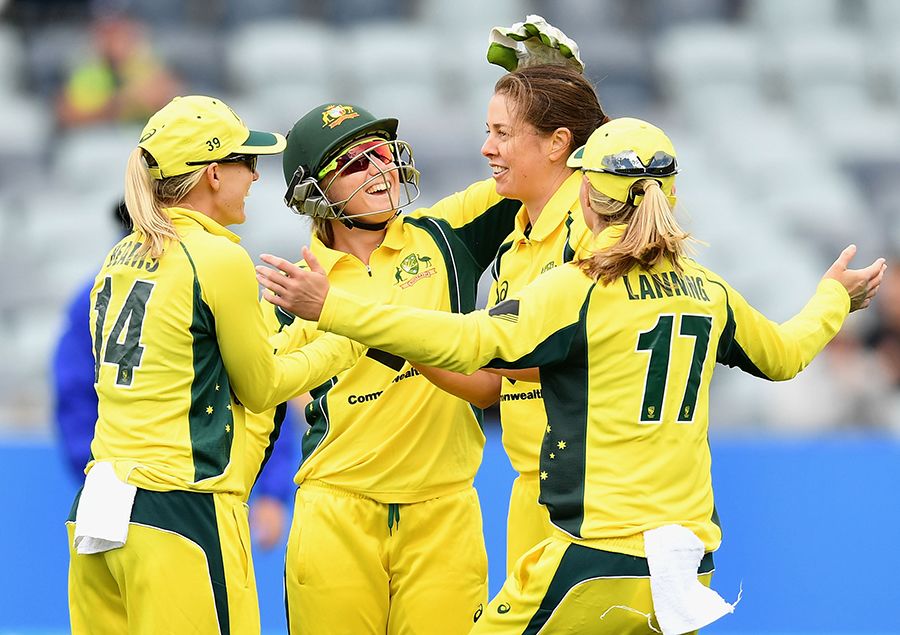 Molly Strano celebrates a wicket with her team-mates