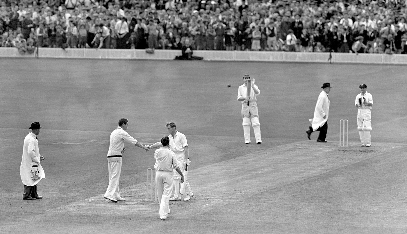 Keith Miller congratulates Peter Richardson on his century