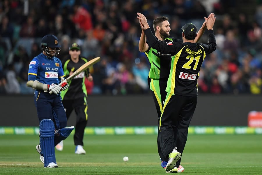 Andrew Tye and Moises Henriques celebrate after removing Milinda Siriwardana