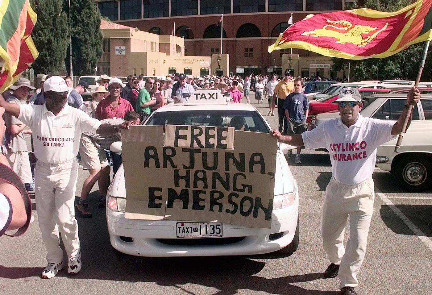 Sri Lankan fans hold up a banner in support of Arjuna Ranatunga