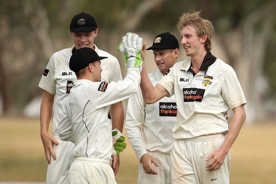 David Moody is congratulated on a five-wicket haul