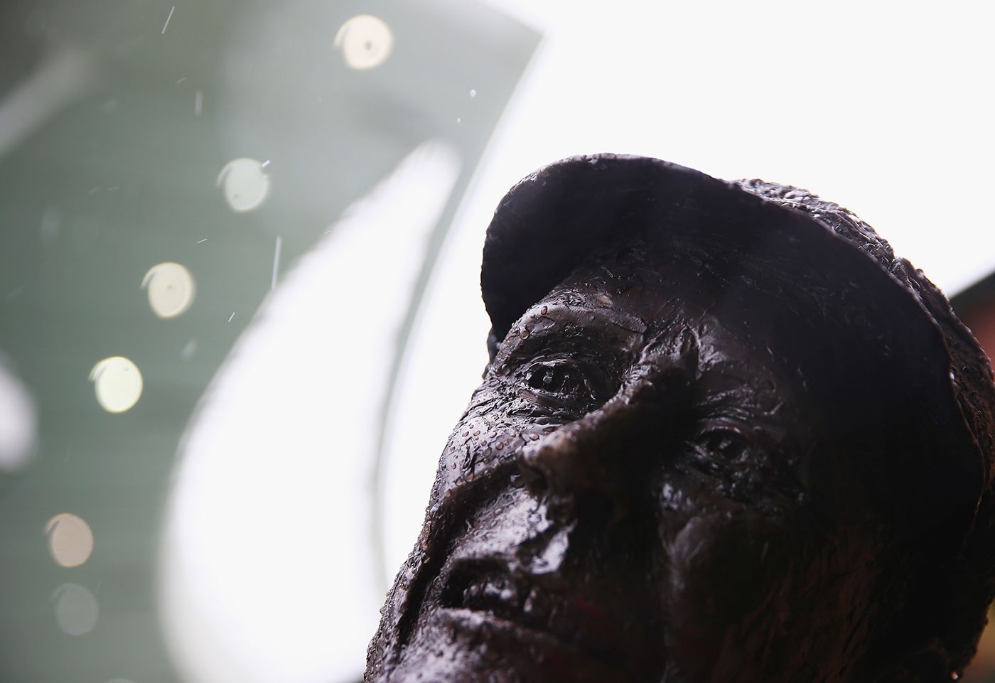 Rain falls on the statue of Stan McCabe