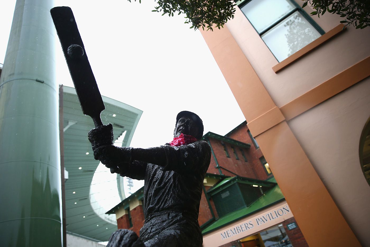 Rain falls on the statue of Stan McCabe