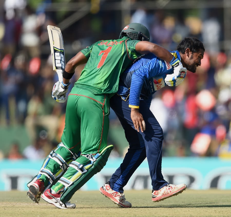 Collision course: Sabbir Rahman bangs into Sachith Pathirana while taking a run