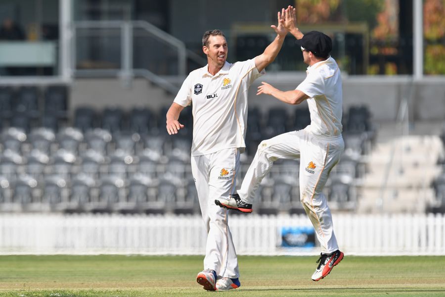 Brent Arnel receives a high-five from his team-mate
