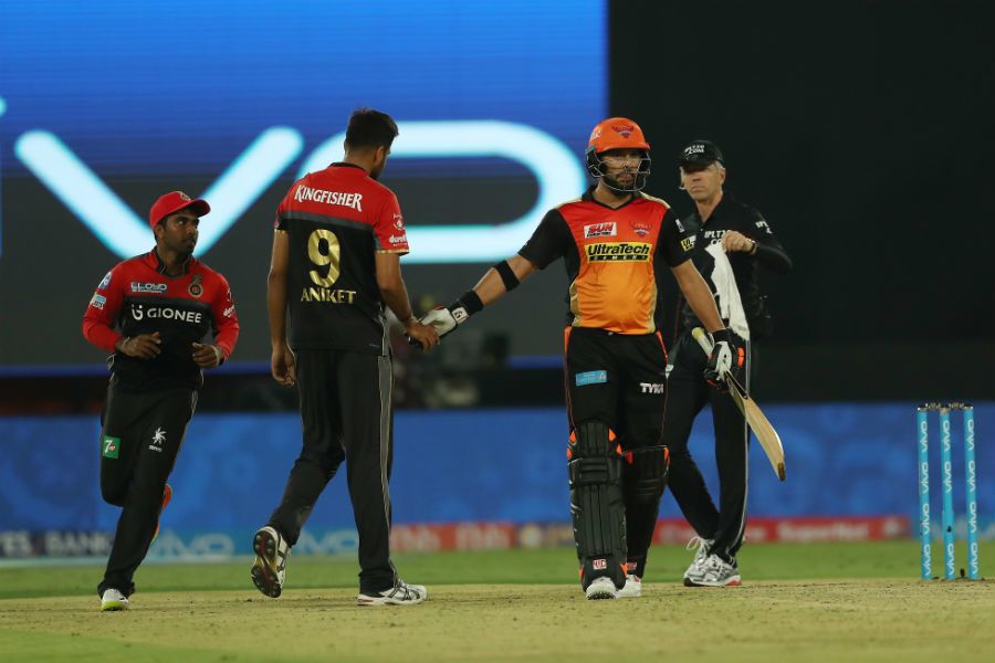 Yuvraj Singh shakes hands with a disconsolate Aniket Choudhary after earning a lifeline