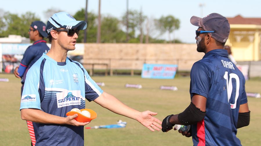 Coach Beau Casson shares bowling advice with USA left-arm spinner Prashanth Nair