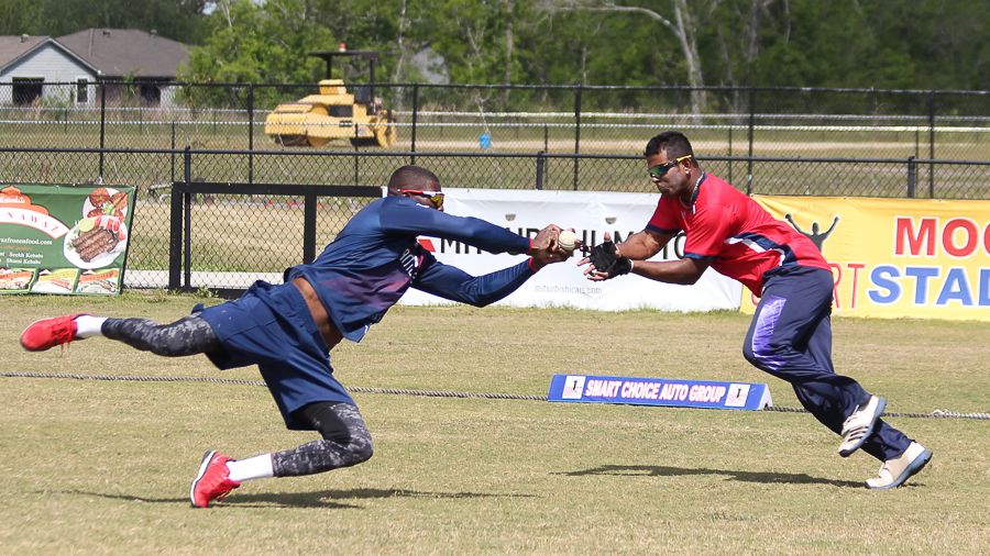 Timroy Allen dives across Roy Silva to take a diving slips catch during a fielding drill