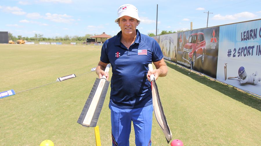 Peter Anderson shows off a prototype bat for training to catch edges