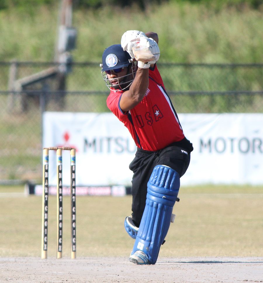 Camilus Alexander drives during his unbeaten half-century in a trial match