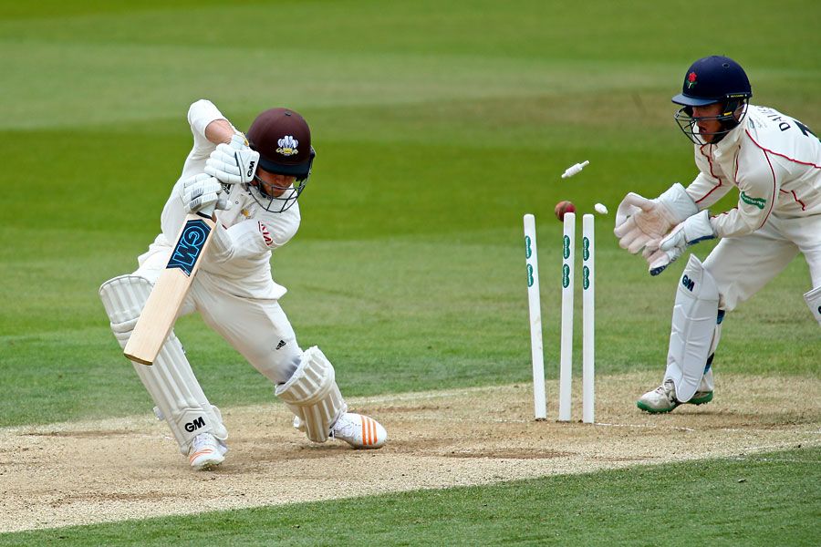 Zafar Ansari misses his drive at Simon Kerrigan