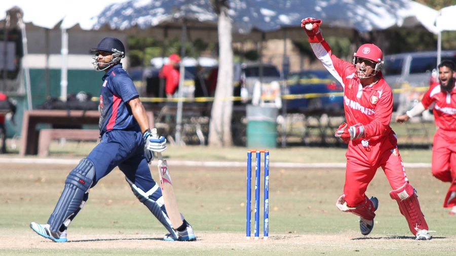 Freddie Klokker roars for a successful caught behind appeal to remove Ravi Timbawala