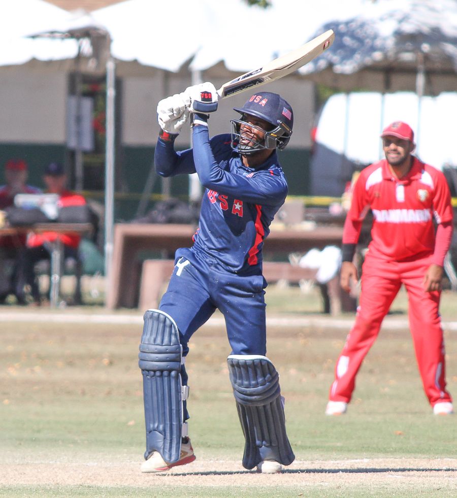 Akeem Dodson drives down the ground for a straight six