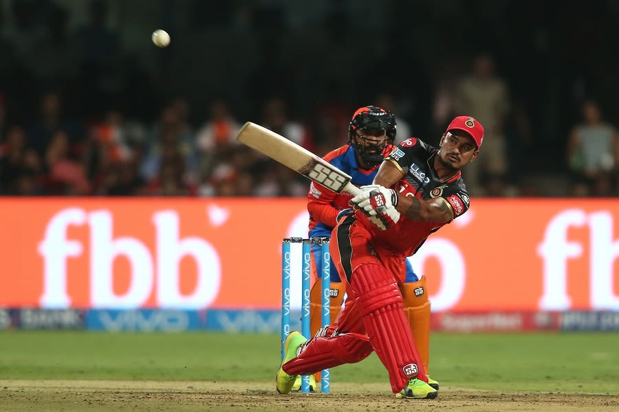 Pawan Negi muscles the ball for a six