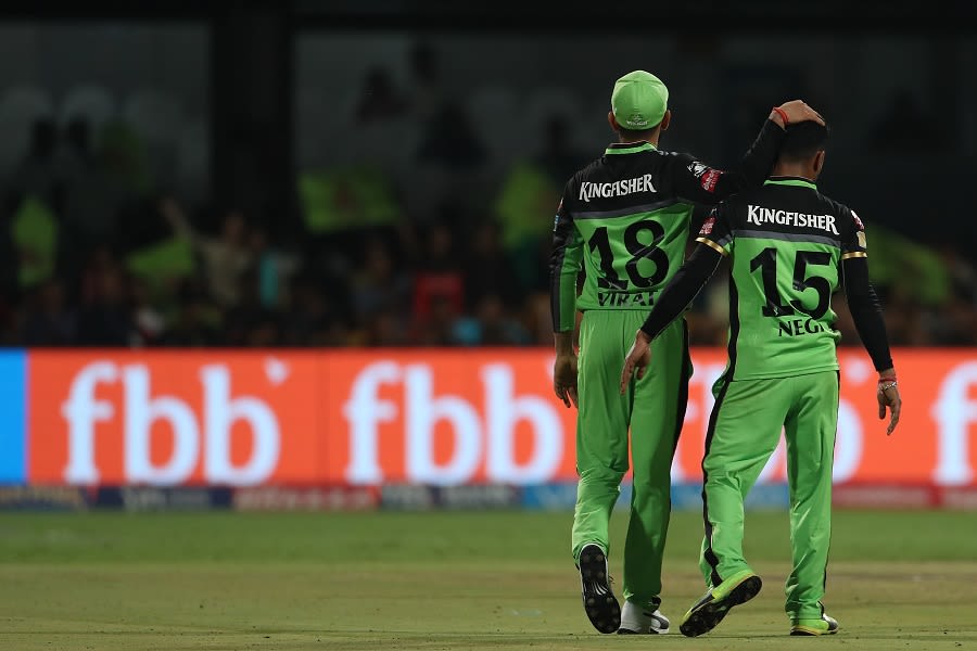 Pawan Negi shares a moment with Virat Kohli after dismissing Colin de Grandhomme
