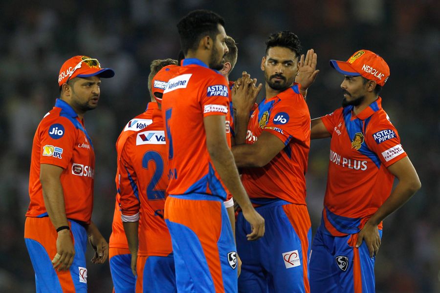 Pradeep Sangwan celebrates the wicket of Martin Guptill with his team-mates