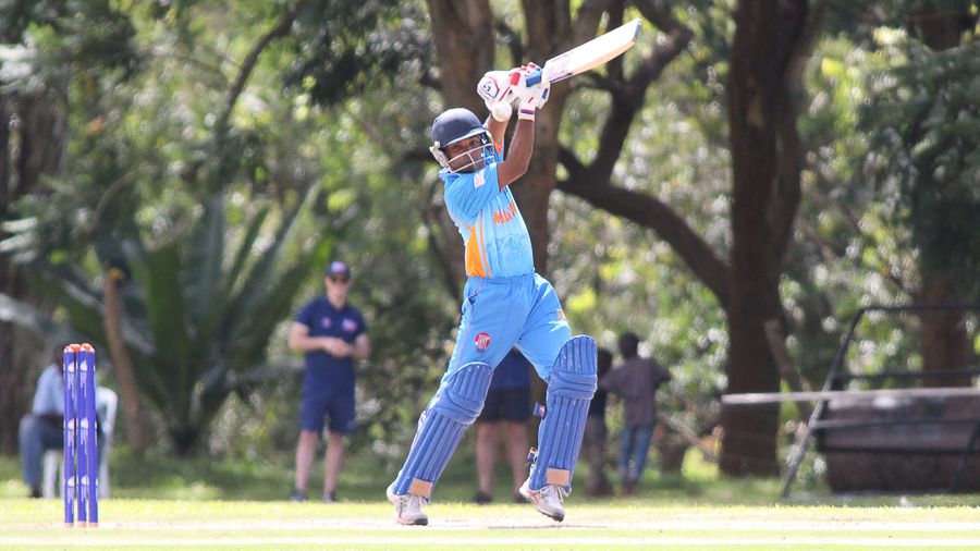 Neville Liyanage drives through cover for a boundary during his 30