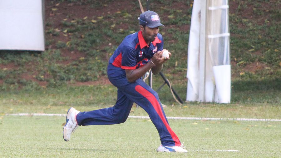 Mrunal Patel holds on to a catch at fine leg to dismiss Selladore Vijayakumar