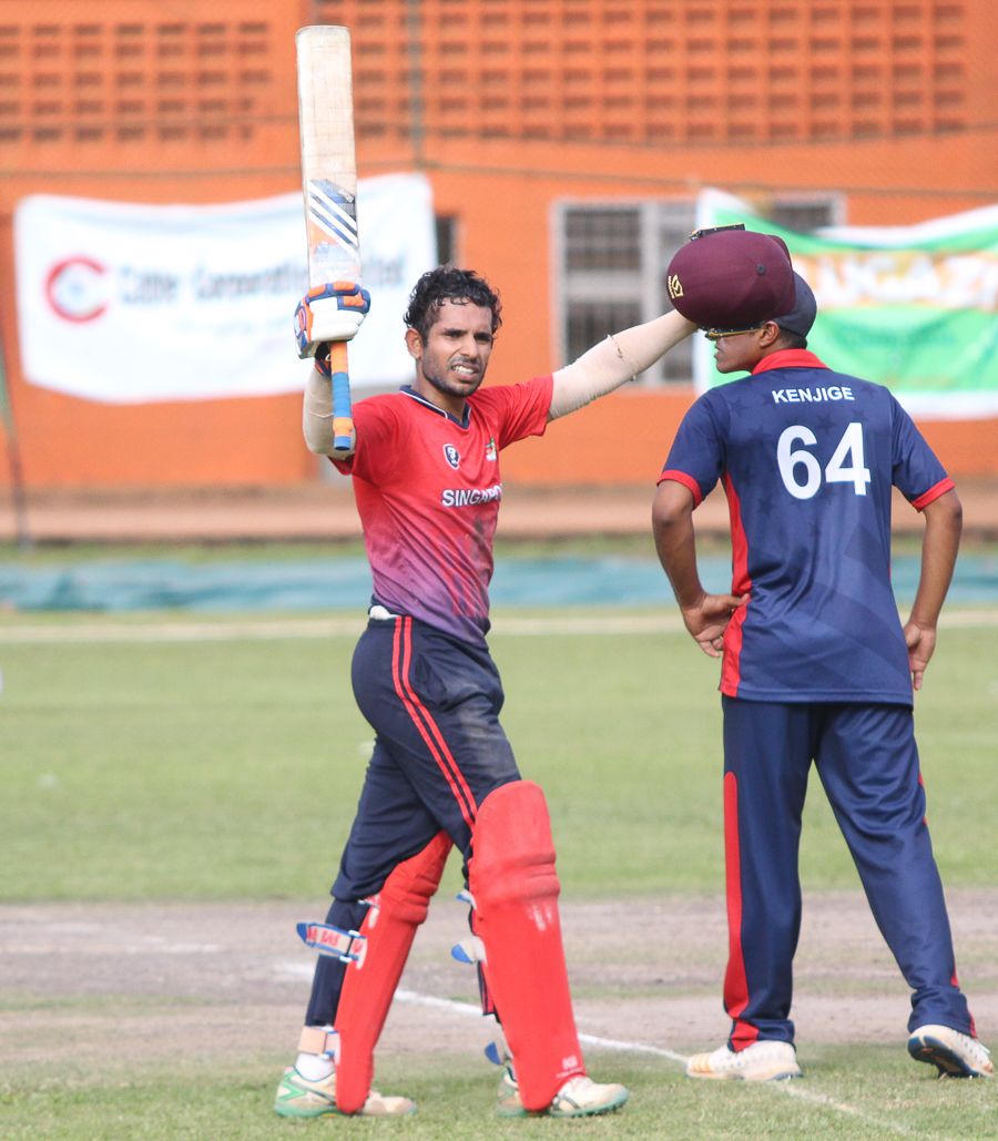 Arjun Mutreja raises his bat after scoring the first century of the tournament