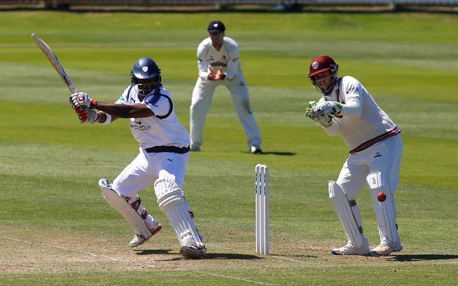 Michael Carberry cuts during his half-century