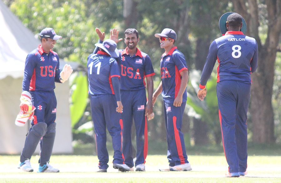 Mrunal Patel gets a high five after bowling Rizwan Cheema