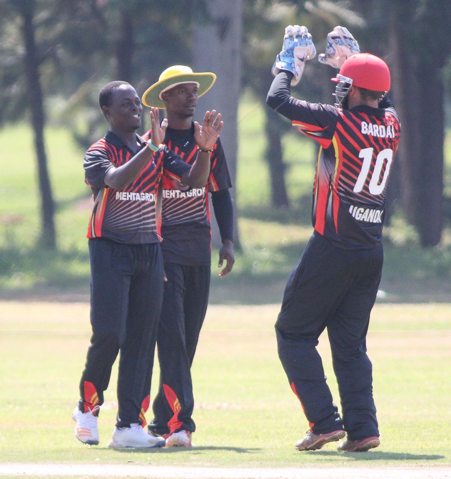 Left-arm spinner Henry Ssenyondo celebrates the wicket of Ibrahim Khaleel