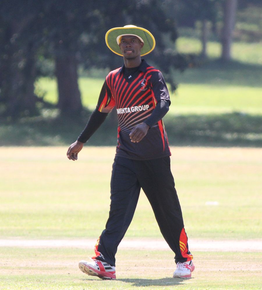 Uganda captain Davis Karashani checks his field settings