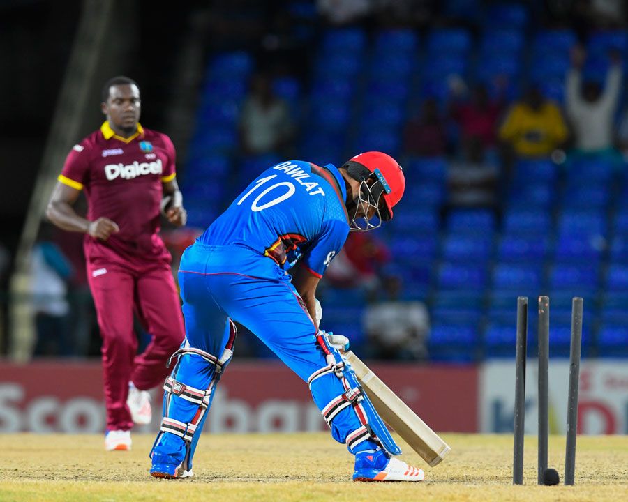 Dawlat Zadran brings the bat down too late against Jerome Taylor's yorker
